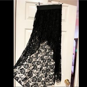 Black lace skirt shirt in front but long in back maxi.